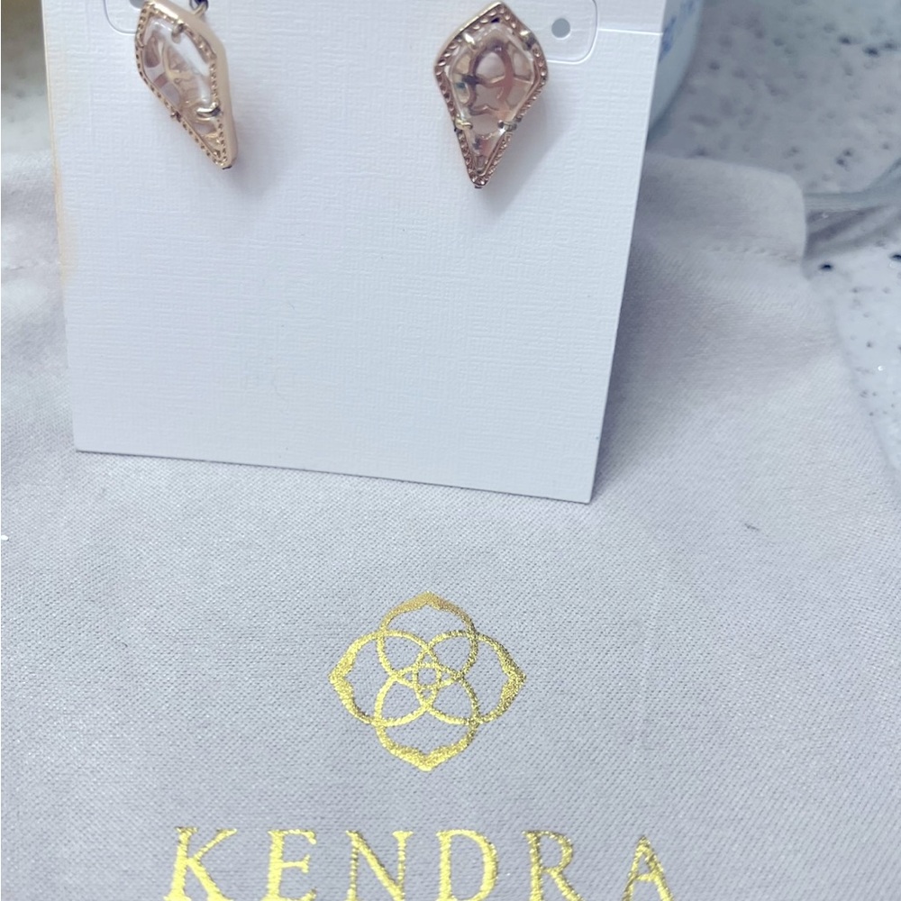 Kendra Scott earrings.